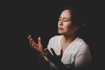 Wall Mural - christianity woman catholic hand pray and worship in the church, Hands folded in prayer concept for faith, spirituality and religion, Hands Raised In Worship background.