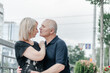 © Владимир Паляница - a man and his wife in black T-shirts are hugging in the city