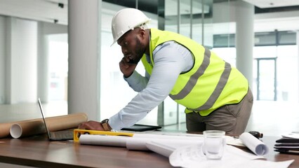 Fototapete - Planning, designing and drawing architect talking on a phone call and working in a modern office building. African American male engineer doing a construction plan project on a blueprint