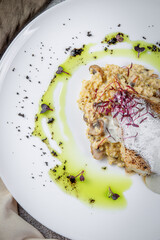 Wall Mural - Volga pikeperch with yellow millet risotto. Fried pikeperch, millet, Parmesan cheese, mushrooms, wine, cheese and cream sauce