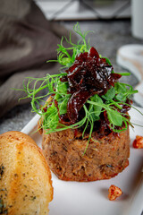 Wall Mural - Salad with liver pate, prunes and pea greens and fried croutons.