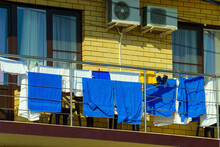 Blue And White Towels Are Dried On The Balcony At The Hotel