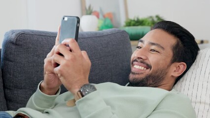 Aufkleber - Texting, happy and relaxing man typing on phone while browsing the internet, playing a game or chatting on social media. Male laughing and enjoying mobile app and funny video while streaming at home