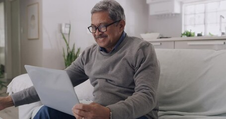 Poster - Mature man streaming on a laptop, watching fun movie and enjoying retirement in home living room with tea, coffee and show. Smiling, happy and relaxed elderly senior using online subscription channel