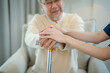 © visoot - Caregiver hold hand of senior man patient give comfort,Express health care sympathy at nursing home,Concept senior people health care.