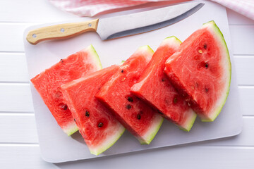 Wall Mural - Slices of red watermelon on cutting board.