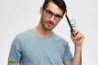 © SHOTPRIME STUDIO - handsome man in blue t-shirt glasses for vision smile emotions isolated background