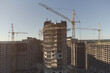 © Happyphotons - Construction of a new residential area. Multi-storey panel houses. Several cranes
