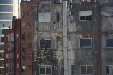 Cleaning of building to be painted