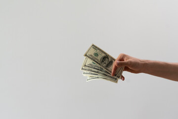 person's hands counting cash money, making an offline payment