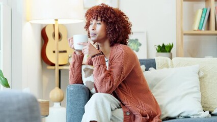 Canvas Print - Relaxing, drinking and thinking African American woman daydreaming enjoying coffee, tea or cosy beverage while calm at home. Casual, leisure and female alone in relaxed environment taking a break.