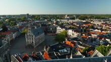 Aerial Fly Over Sint-Janskerk Towards Gouda's Market Square In Holland, Netherlands. Aerial Drone Shot