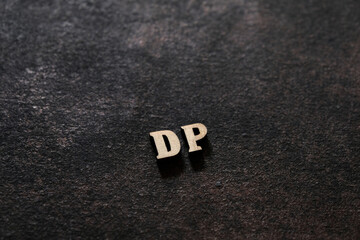 Wall Mural - The letters D and P above the dark field. Initials DP