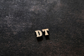Wall Mural - The letters D and T above the dark field. Initials DT