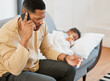 © Kay Abrahams/peopleimages.com - Worried father concerned, caring for sick son calling a doctor and taking temperature check of his sleeping kid at home. Parent consulting with professional and taking care of child with fever