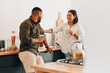 © Kay Abrahams/peopleimages.com - Playful, coffee and loving couple bonding and having fun together in the kitchen at home. Smiling, in love and carefree couple laughing and sharing a romantic moment while enjoying the weekend.