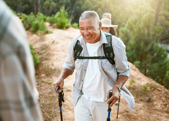 hike, trekking sticks and senior male walking with friends for fitness and health in nature. healthy