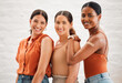 © Kay Abrahams/peopleimages.com - Covid vaccination or flu shot inside of girl friends, female friendship and teenagers smiling. Portrait of a happy and diverse friend group standing and practicing good health habits together