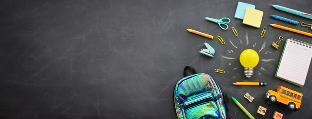 Poster - Education concept image. Creative idea and innovation. light bulb metaphor over blackboard background