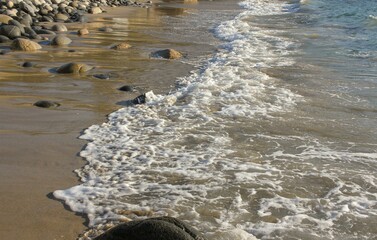 Wall Mural - the sound of the waves licking the coast