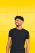 © ADDICTIVE STOCK - Happy Young Man Looking Away