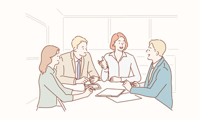 Wall Mural - group of young business people working and communicating while sitting at the office desk together w