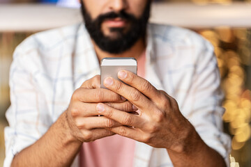 Sticker - people, technology and communication concept - close up of man with smartphone at restaurant