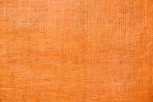 Texture Of Orange Burlap Fabric As Background, Top View