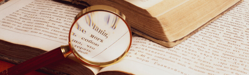 old books. examination with a magnifying glass. binding volumes