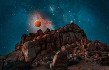 Wall Mural - silhouette of the person on the ancient rock meditating or praying at night under the stars and full moon