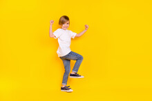 Full Length Body Size View Of Handsome Cheerful Lucky Pre-teen Boy Dancing Rejoicing Isolated Over Shine Yellow Color Background