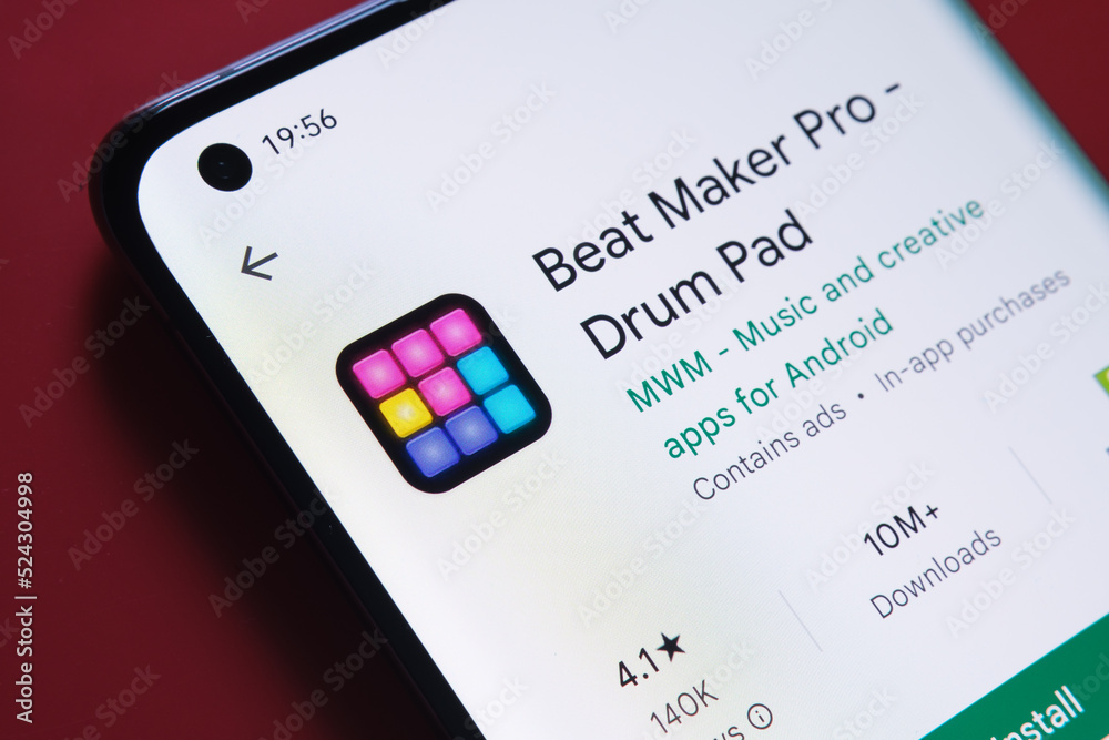 beat maker pro app seen in Google Play Store on the smartphone screen placed on red background. Close up photo with selective focus. Stafford, United Kingdom, August 2, 2022.