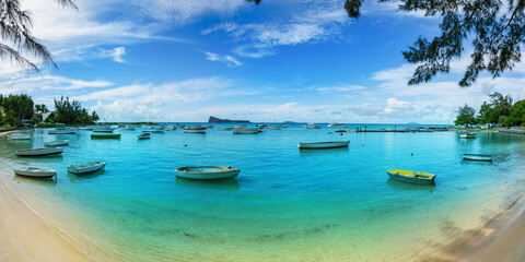 Wall Mural - Public blue bay beach in the summertime in Mauritius island, Africa