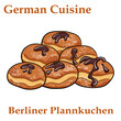 Berliner plannkuchen. German donuts - berliner with jam and icing sugar in a tray