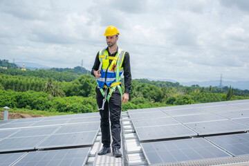 Poster - Engineer working and maintenance with solar batteries near solar panels at sunny day on roof structure of building factory,Alternative energy to conserve the world's energy.
