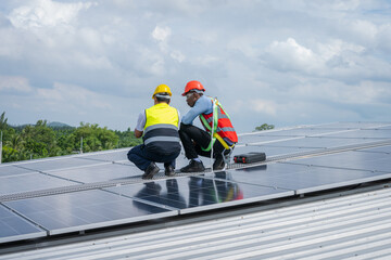 Poster - Engineers checking the operation of the system solar cell on an building in an residential area,Photovoltaic module idea for clean energy production.