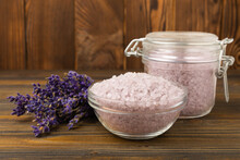 Lavender Sea Salt On A Brown Wooden Background. Himalayan Sea Salt And Lavender Flowers. Salt Crystals From The Dead Sea.Spa Concept. Space For Copy. View From Above