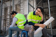 © KANGWANS - engineer or worker Tired of working hard at the construction site. Feeling stressed and tired from work. Labor workers shocked, despaired, discouraged at the construction site.