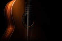 Classical Guitar Close Up, Dramatically Lit On A Black Background With Copy Space