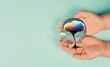 Holding a head with a colorful tree in the hands, symbol for creativity,  connection to nature and positive emotion, living in a dream world
