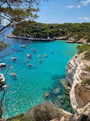 View of turquoise sea in beautiful bay Cala Mitjaneta in Menorca