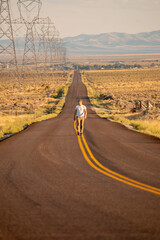 Wandering at sunset in the middle of the road