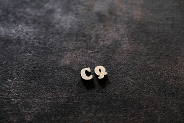 Wall Mural - The letters C and Q above the dark field. Initials CQ
