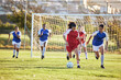 © Alexis Scholtz/peopleimages.com - Sports team, girl soccer and kick ball on field in a tournament. Football, competition and athletic female teen group play game on grass. Fit adolescents compete to win match at school championship.