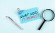 WHAT DOES IT MEANS text written on sticky with magnifier and pen, business concept