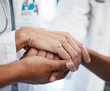 © Emily N/peopleimages.com - Doctor, holding a patients hands and comforting them after the loss of a loved one at a hospital. Medical consultant, reassuring sick person after a cancer diagnosis and giving support or treatment.
