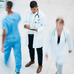Aufkleber - Busy hospital with doctor browsing on tablet for test results, patient records and medical research from above. Healthcare professional and expert working on treatment plan in a bustling clinic