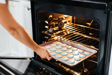 The process of making macaroons. Cookie baking. The cookies are baked in the oven. Making macaroons. Baking is in the oven.