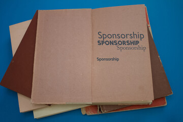 Sponsorship word in opened book with vintage, natural patterns old antique paper design.