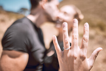 Engagement, proposal and romance while showing off her diamond ring and saying yes to marriage outside. Closeup hand of a young romantic couple telling you to save the date for their wedding day